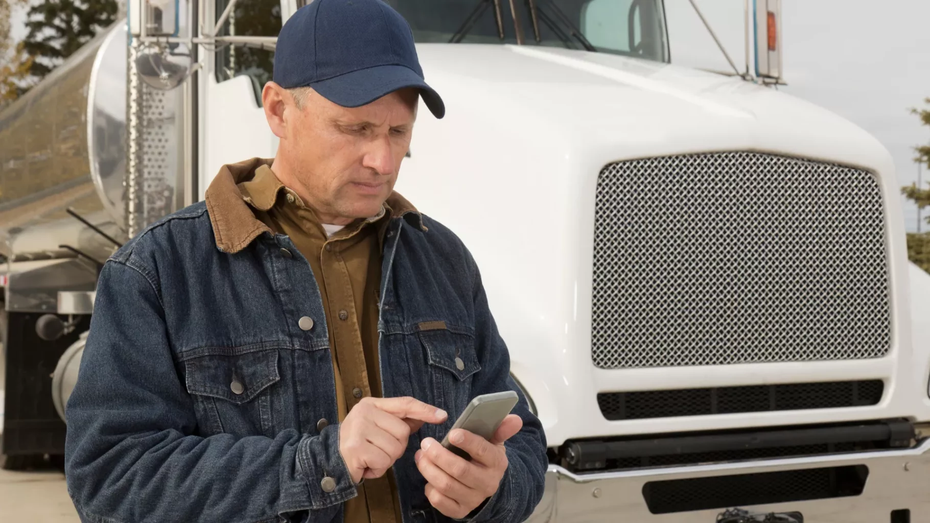 a-trucker-is-calculating-an-insurance a-trucker-is-calculating-an-insurance